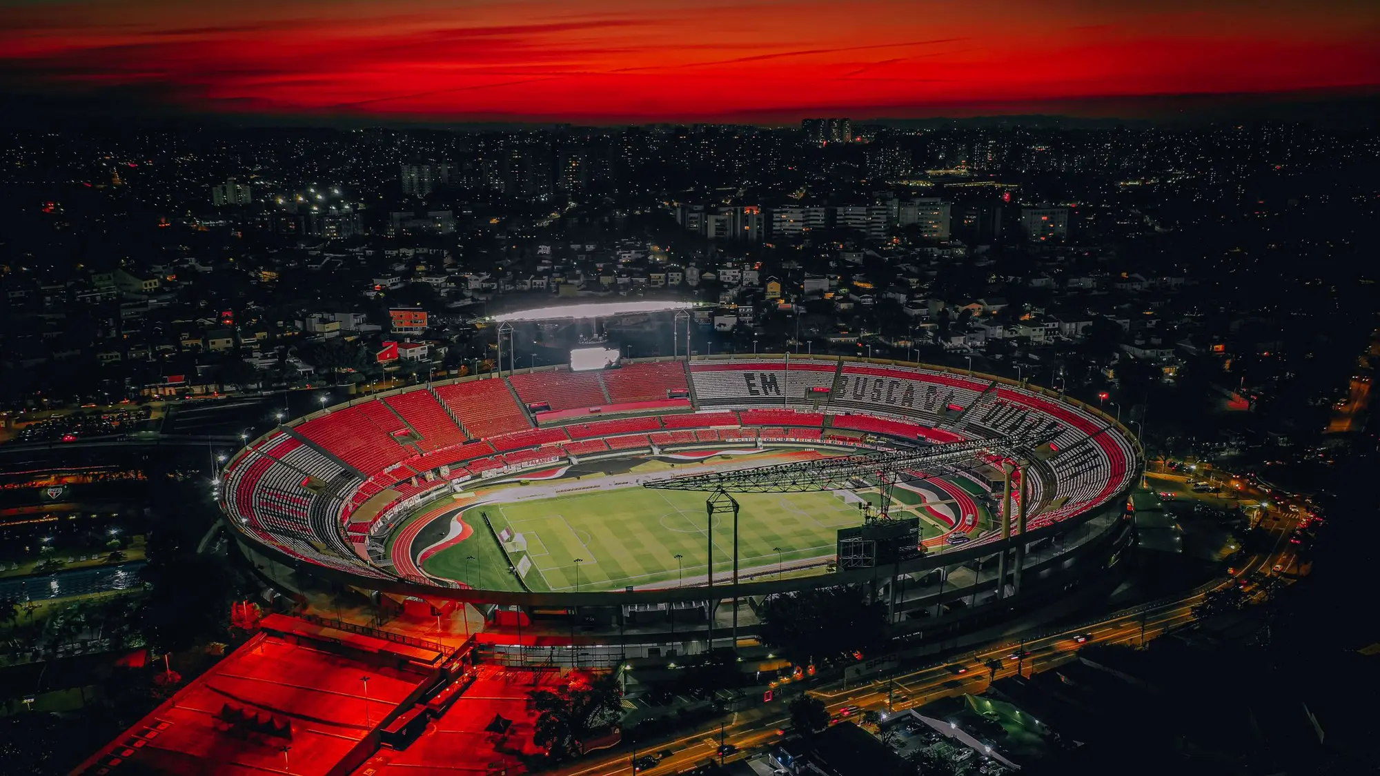 Floodlit stadium at night